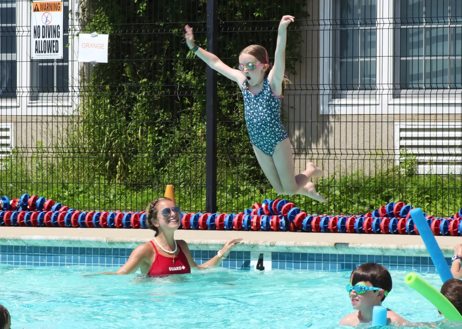 Fessenden Summer Camps girl jumping into pool